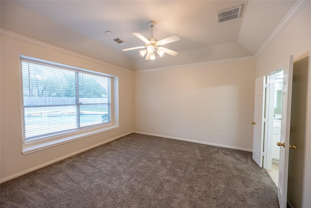 spare room with carpet flooring, visible vents, and ceiling fan
