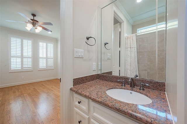 1804 Haddon St, Houston, TX 77019 - full bathroom featuring ornamental molding, vanity, a ceiling fan, wood finished floors, and baseboards