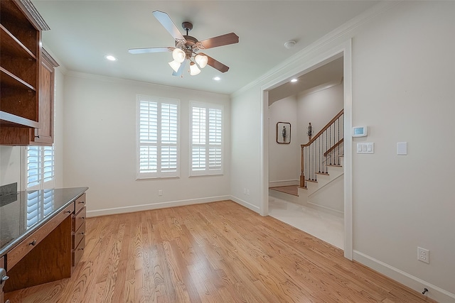 1804 Haddon St, Houston, TX 77019 - unfurnished dining area featuring a ceiling fan, ornamental molding, plenty of natural light, stairs, and light wood-type flooring