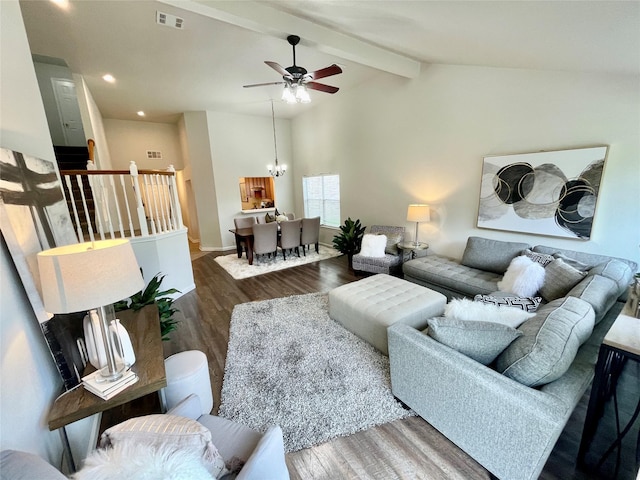 living area featuring wood finished floors, lofted ceiling with beams, ceiling fan with notable chandelier, baseboards, and visible vents