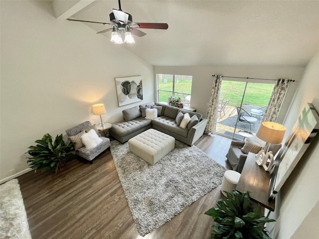 living area featuring baseboards, wood finished floors, a ceiling fan, and vaulted ceiling
