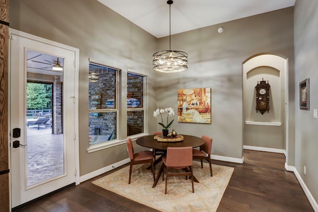 5111 Water Oak Cres, Fulshear, TX 77441 - dining room with baseboards, a chandelier, and dark wood-type flooring