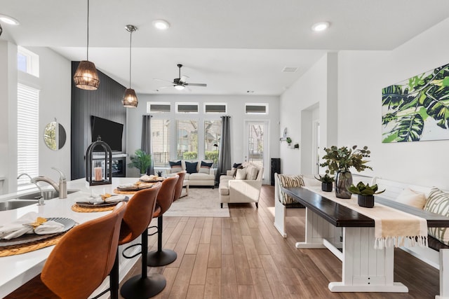 dining room featuring visible vents, wood finished floors, recessed lighting, and a ceiling fan