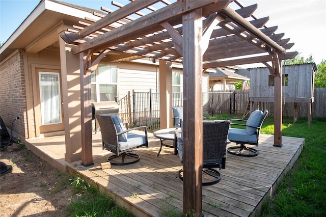 wooden deck with a pergola and fence