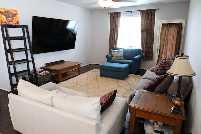 living area with wood finished floors and baseboards