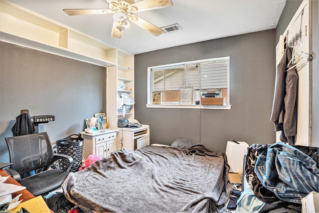 bedroom featuring ceiling fan and visible vents