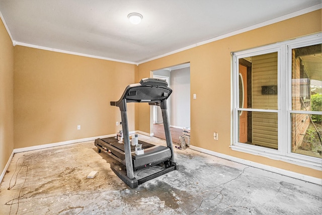 workout area with baseboards, a wood stove, and crown molding