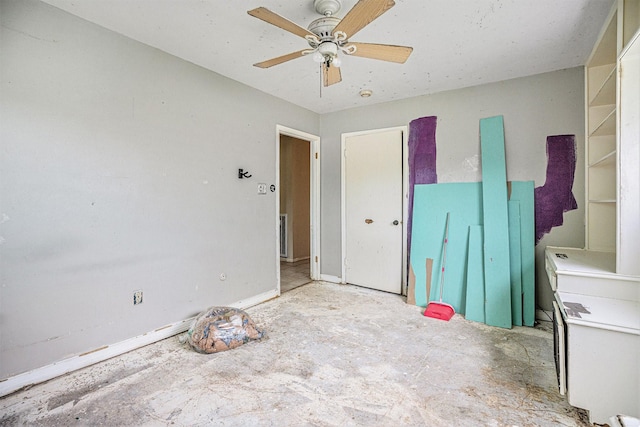 unfurnished bedroom with ceiling fan and unfinished concrete floors