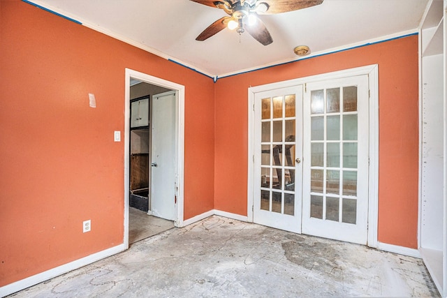 unfurnished room with french doors, unfinished concrete flooring, baseboards, and ceiling fan