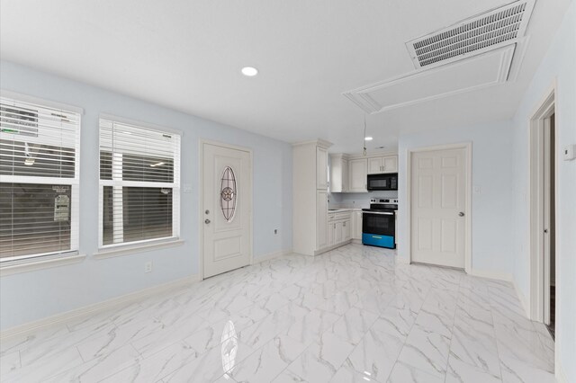 unfurnished living room featuring baseboards, marble finish floor, visible vents, and attic access