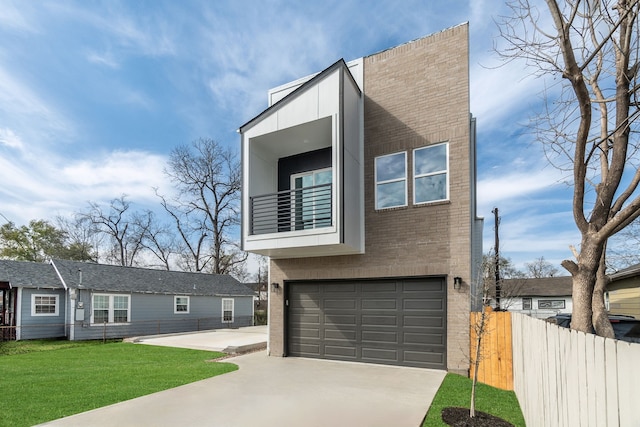 contemporary home with driveway, fence, brick siding, a balcony, and a garage