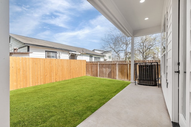 view of yard featuring a patio and a fenced backyard
