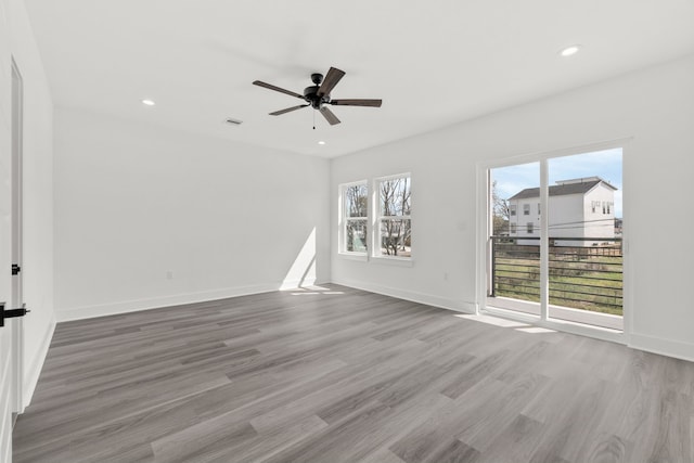 unfurnished room featuring visible vents, baseboards, ceiling fan, wood finished floors, and recessed lighting