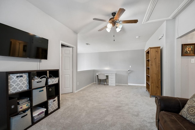 interior space featuring a ceiling fan, baseboards, and vaulted ceiling