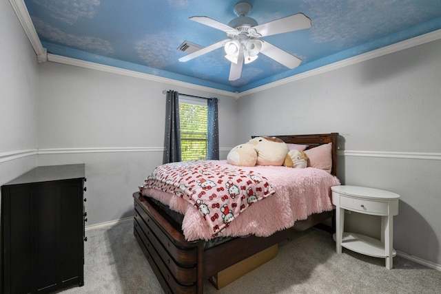 carpeted bedroom with baseboards, a ceiling fan, crown molding, and visible vents