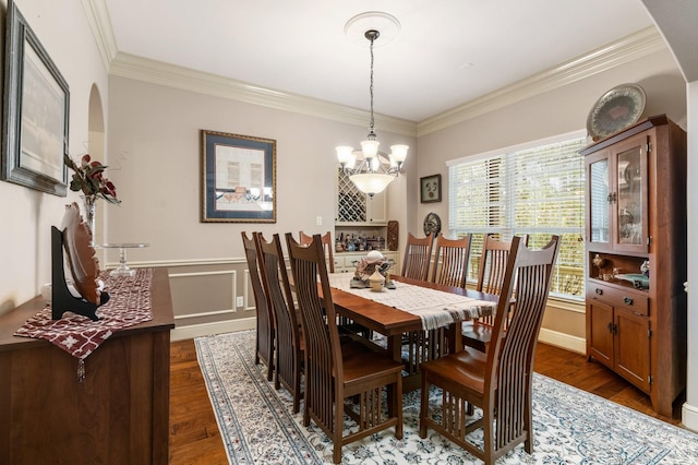 8408 Grand Lake Estates Dr, Montgomery, TX 77316 - dining room featuring an inviting chandelier, a wainscoted wall, ornamental molding, and dark wood-type flooring