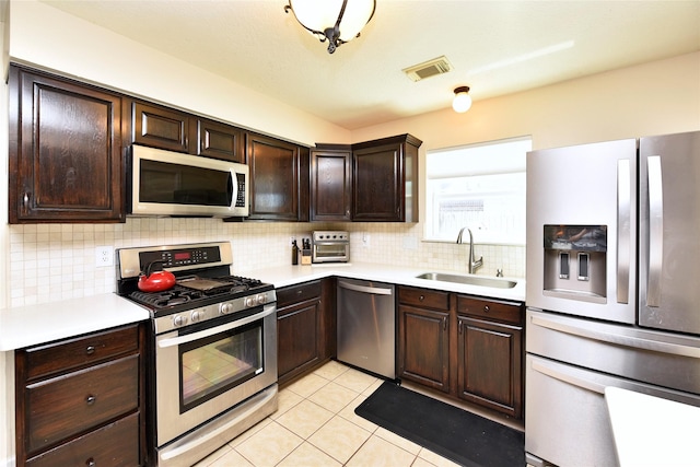 kitchen featuring light countertops, visible vents, appliances with stainless steel finishes, and a sink