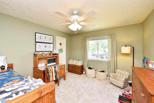 carpeted bedroom with a ceiling fan