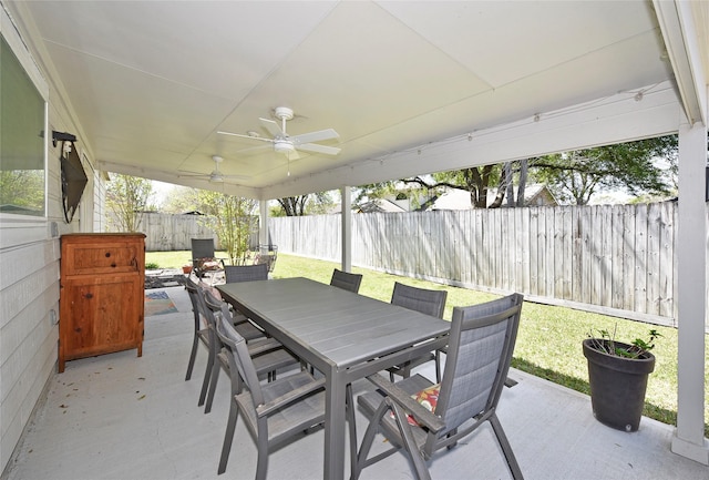 view of patio / terrace featuring a ceiling fan, a fenced backyard, and outdoor dining area