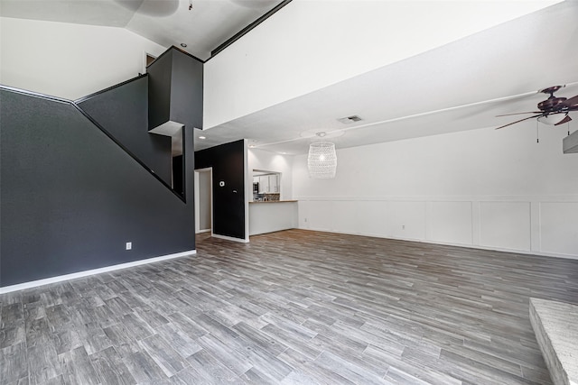 3226 Poe Dr, Montgomery, TX 77356 - unfurnished living room featuring visible vents, ceiling fan, high vaulted ceiling, and wood finished floors
