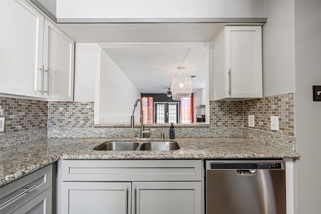 3226 Poe Dr, Montgomery, TX 77356 - kitchen featuring white cabinets, dishwasher, a sink, and backsplash