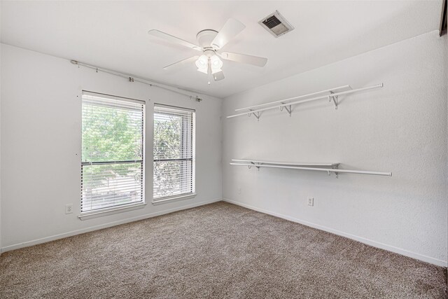 3226 Poe Dr, Montgomery, TX 77356 - interior space with carpet, visible vents, baseboards, and ceiling fan