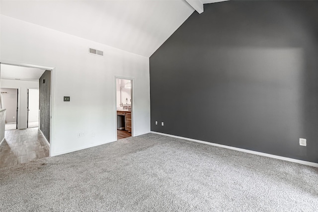3226 Poe Dr, Montgomery, TX 77356 - carpeted empty room with high vaulted ceiling, visible vents, baseboards, and beamed ceiling