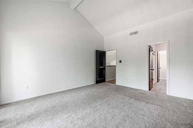 3226 Poe Dr, Montgomery, TX 77356 - unfurnished bedroom with baseboards, light carpet, visible vents, beam ceiling, and high vaulted ceiling