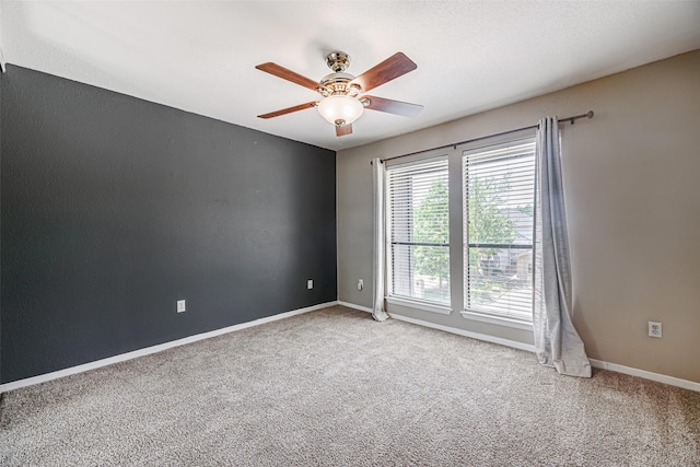 3226 Poe Dr, Montgomery, TX 77356 - carpeted spare room featuring baseboards and ceiling fan