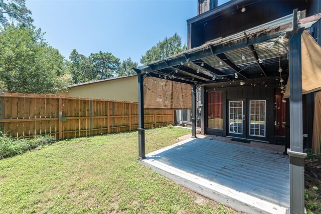 3226 Poe Dr, Montgomery, TX 77356 - exterior space featuring french doors, a wooden deck, and fence