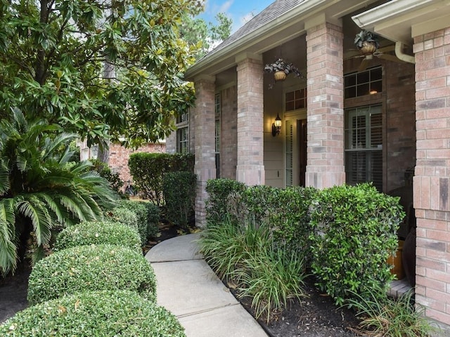 31 Trilling Bird Pl, The Woodlands, TX 77384 - entrance to property featuring brick siding and a shingled roof