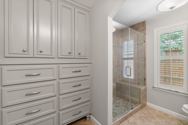 31 Trilling Bird Pl, The Woodlands, TX 77384 - full bathroom with a stall shower, tile patterned floors, and a textured ceiling