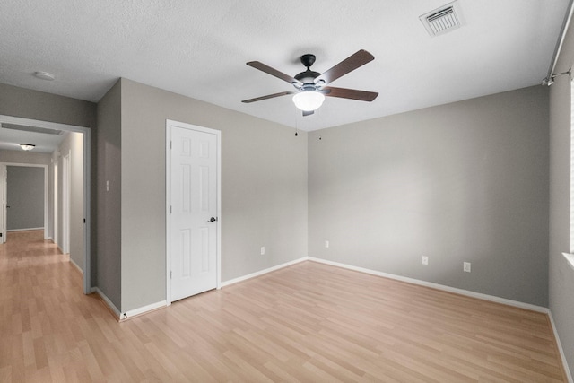 31 Trilling Bird Pl, The Woodlands, TX 77384 - unfurnished bedroom with light wood-style floors and ceiling fan