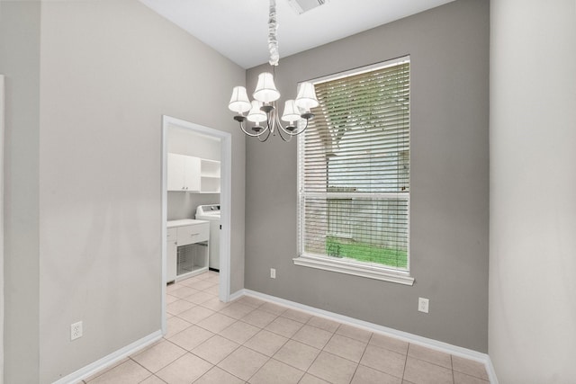 31 Trilling Bird Pl, The Woodlands, TX 77384 - spare room with a chandelier, washer / clothes dryer, and light tile patterned flooring