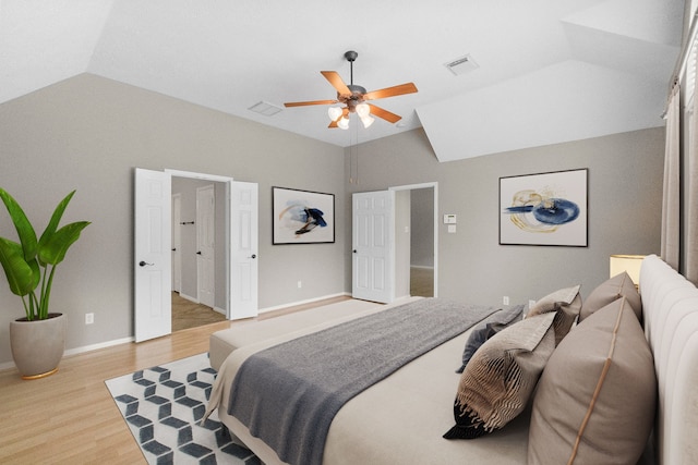 31 Trilling Bird Pl, The Woodlands, TX 77384 - bedroom featuring vaulted ceiling, light wood finished floors, and a ceiling fan