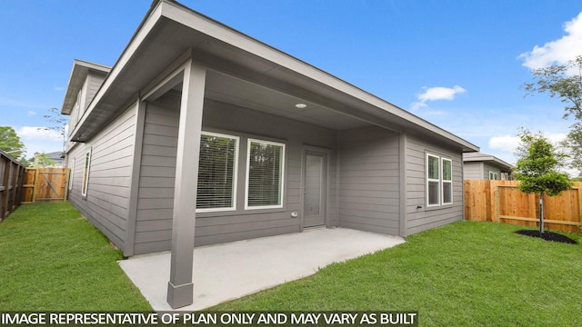 522 Belle Springs Ln, Conroe, TX 77301 - back of house with a fenced backyard, a lawn, and a patio area