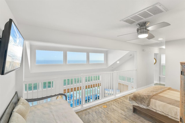 17431 Bristow Dr, Galveston, TX 77554 - bedroom with wood finished floors, baseboards, ceiling fan, and visible vents