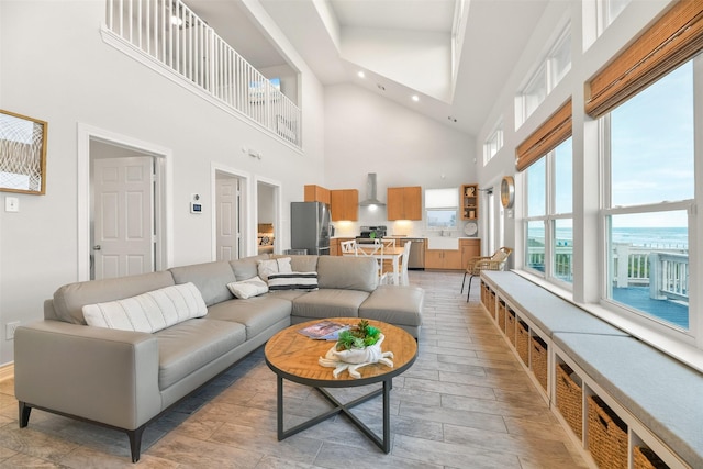 17431 Bristow Dr, Galveston, TX 77554 - living area featuring light wood finished floors, a high ceiling, and recessed lighting