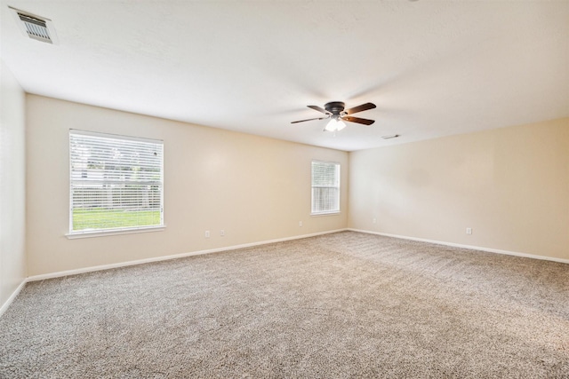 7107 Grant Dr, Magnolia, TX 77354 - carpeted spare room with a ceiling fan and baseboards