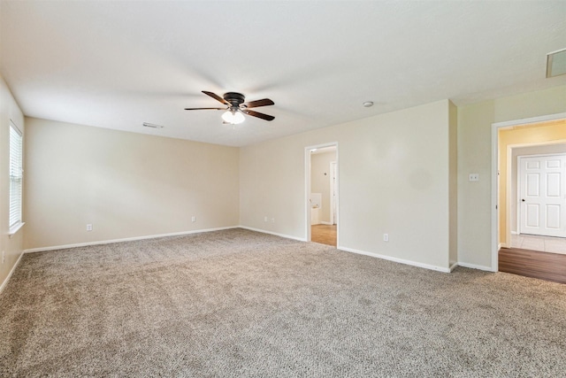 7107 Grant Dr, Magnolia, TX 77354 - unfurnished room featuring ceiling fan, carpet floors, and baseboards