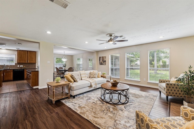 7107 Grant Dr, Magnolia, TX 77354 - living area with dark wood-style floors, recessed lighting, baseboards, and ceiling fan