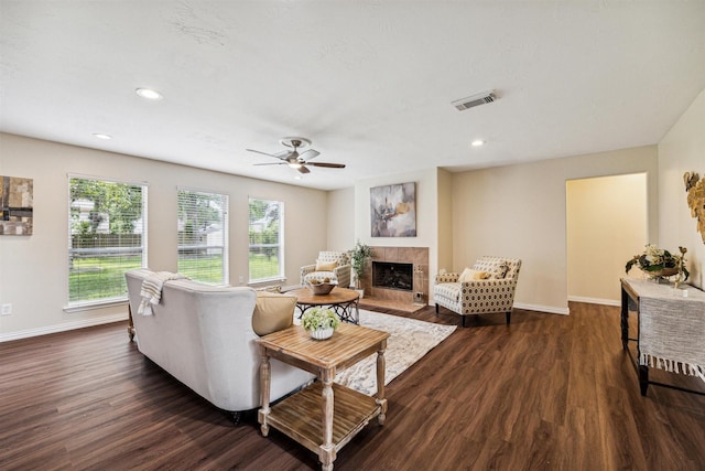 7107 Grant Dr, Magnolia, TX 77354 - living room with dark wood-style flooring, a tile fireplace, baseboards, and recessed lighting