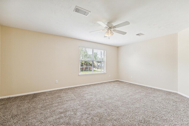 7107 Grant Dr, Magnolia, TX 77354 - empty room with a ceiling fan, carpet, and baseboards