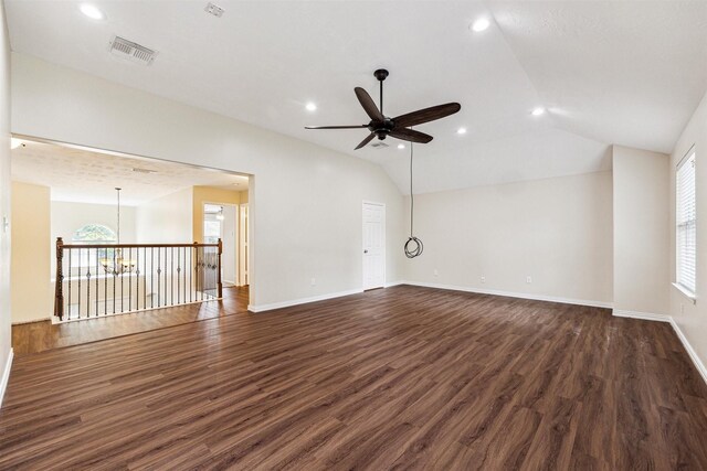 7107 Grant Dr, Magnolia, TX 77354 - unfurnished living room featuring a ceiling fan, dark wood-style floors, recessed lighting, plenty of natural light, and vaulted ceiling