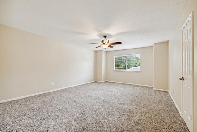 7107 Grant Dr, Magnolia, TX 77354 - spare room with carpet floors, ceiling fan, and baseboards