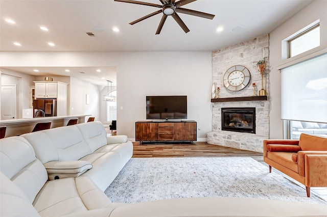12306 Wildrye Prairie Trce, Humble, TX 77346 - living room featuring a ceiling fan, recessed lighting, a healthy amount of sunlight, and wood finished floors