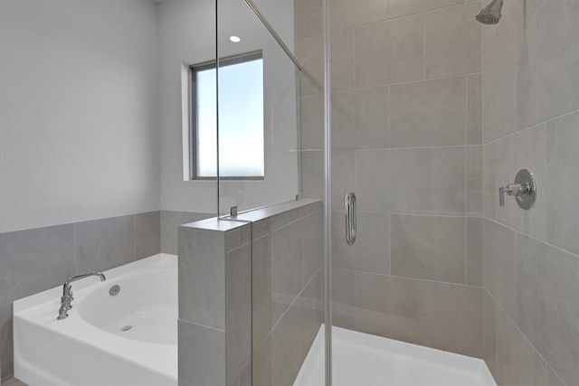5028 Marcasca Dr, Katy, TX 77493 - full bathroom featuring a garden tub and a stall shower