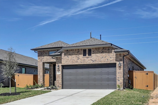 5028 Marcasca Dr, Katy, TX 77493 - view of front of home with fence, a front lawn, brick siding, an attached garage, and driveway