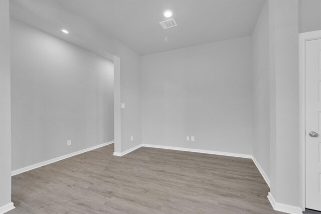 5028 Marcasca Dr, Katy, TX 77493 - empty room with visible vents, baseboards, and wood finished floors