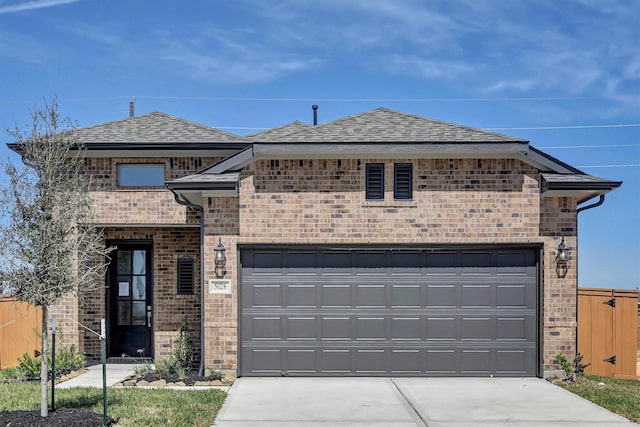 5028 Marcasca Dr, Katy, TX 77493 - view of front facade featuring roof with shingles, brick siding, and driveway